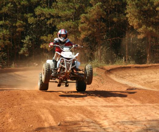 An ATV is a vehicle designed for driving on all types of terrain, including grass and dirt.