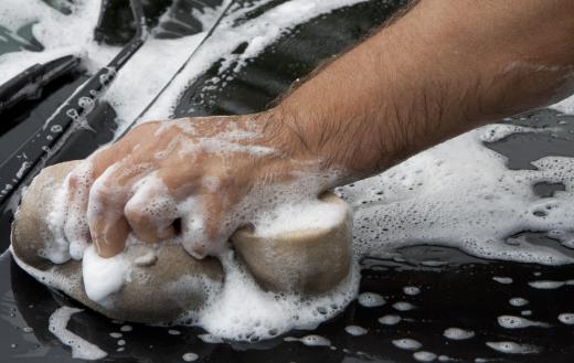 Employees clean a car by hand at some businesses.