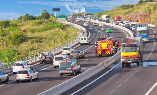 Concrete barriers are often used to divide highways with multiple lanes.