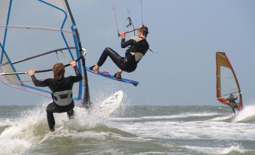 Windsurfing is an aquatic sport which combines the disciplines of sailing and surfing.