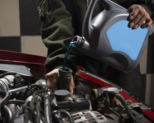 Checking and topping up engine coolant is a simple type of engine maintenance.