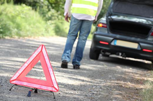 Hazard lights are used when a disabled car is parked on the side of the road.