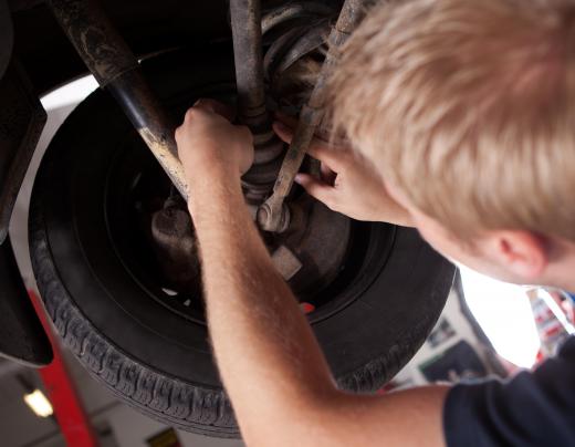 A mechanic performs regular inspections on brake and steering systems.