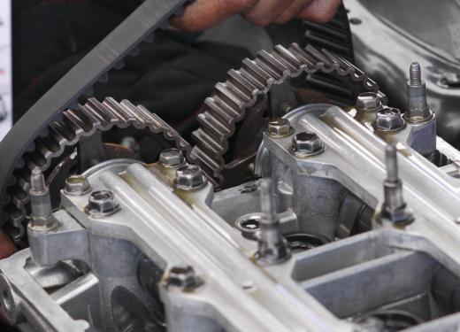 The timing gear and belt or chain in a car are protected by a timing cover.